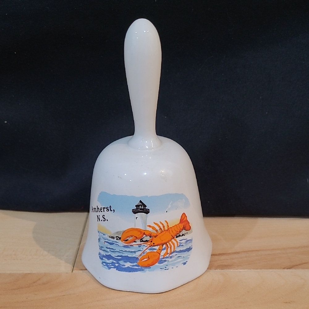2/$20 White and Orange Amherst, N.S. Ceramic Bell with Lobster Design